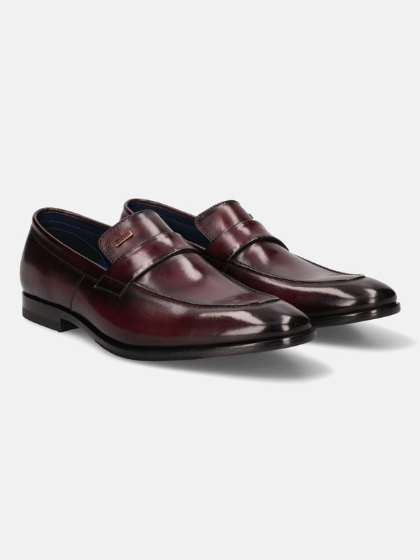 A grey Men's bugatti Penny Loafer featuring a round toe apron toe, stacked heel. Made from premium genuine leather with a durable leather outsole, this slip-on design offers both style and comfort.