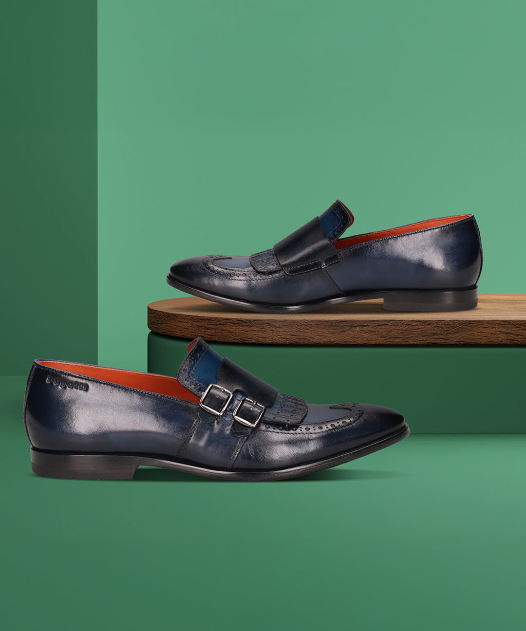 Bugatti Rico dark blue premium leather slip-on formal shoes with buckle detail and orange lining.
