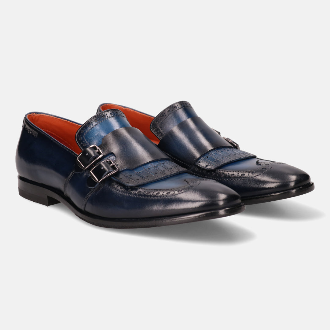 A blue Men's bugatti Kiltie Loafer featuring a round toe wingcap, stacked heel. Made from premium genuine leather with a durable leather outsole, this buckle design offers both style and comfort.