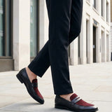 Lifestyle image of bugatti Rico black leather penny loafers with a burgundy suede accent.
