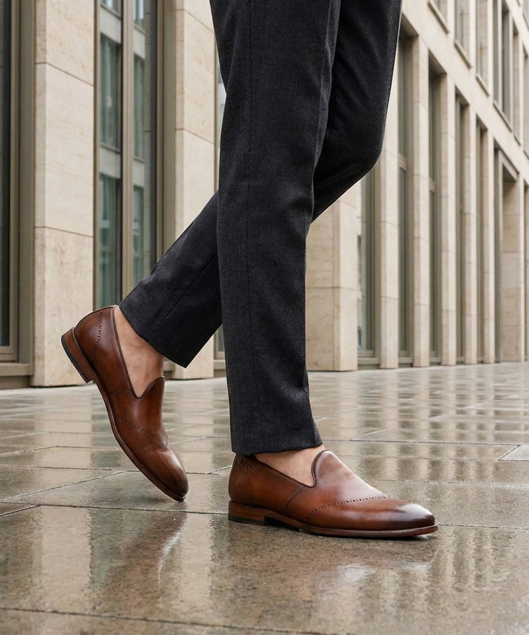 Lifestyle shot of bugatti Rico cognac premium leather slip-on formal shoes with a classic style.