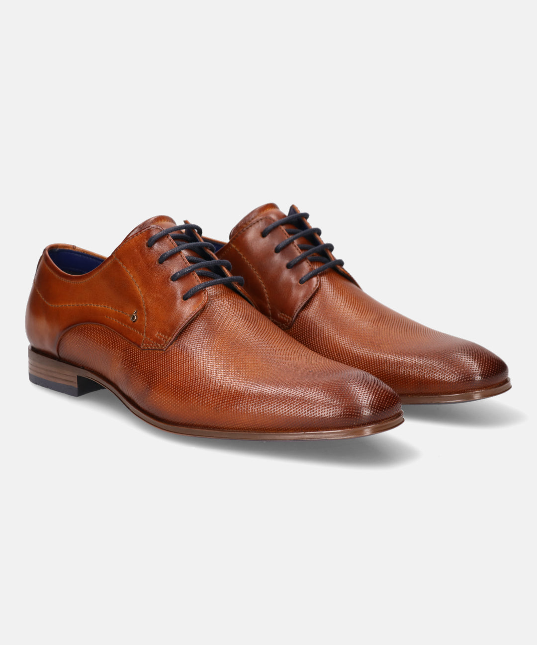 A cognac Men's bugatti Derby featuring a round toe medallion toe, stacked heel. Made from premium genuine leather with a durable high quality synthetic outsole, this laces design offers both style and comfort.
