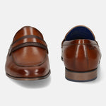 Men's Bugatti penny loafer cognac leather shoes with a round toe and apron toe featuring a moulded heel , a pvc outsole.