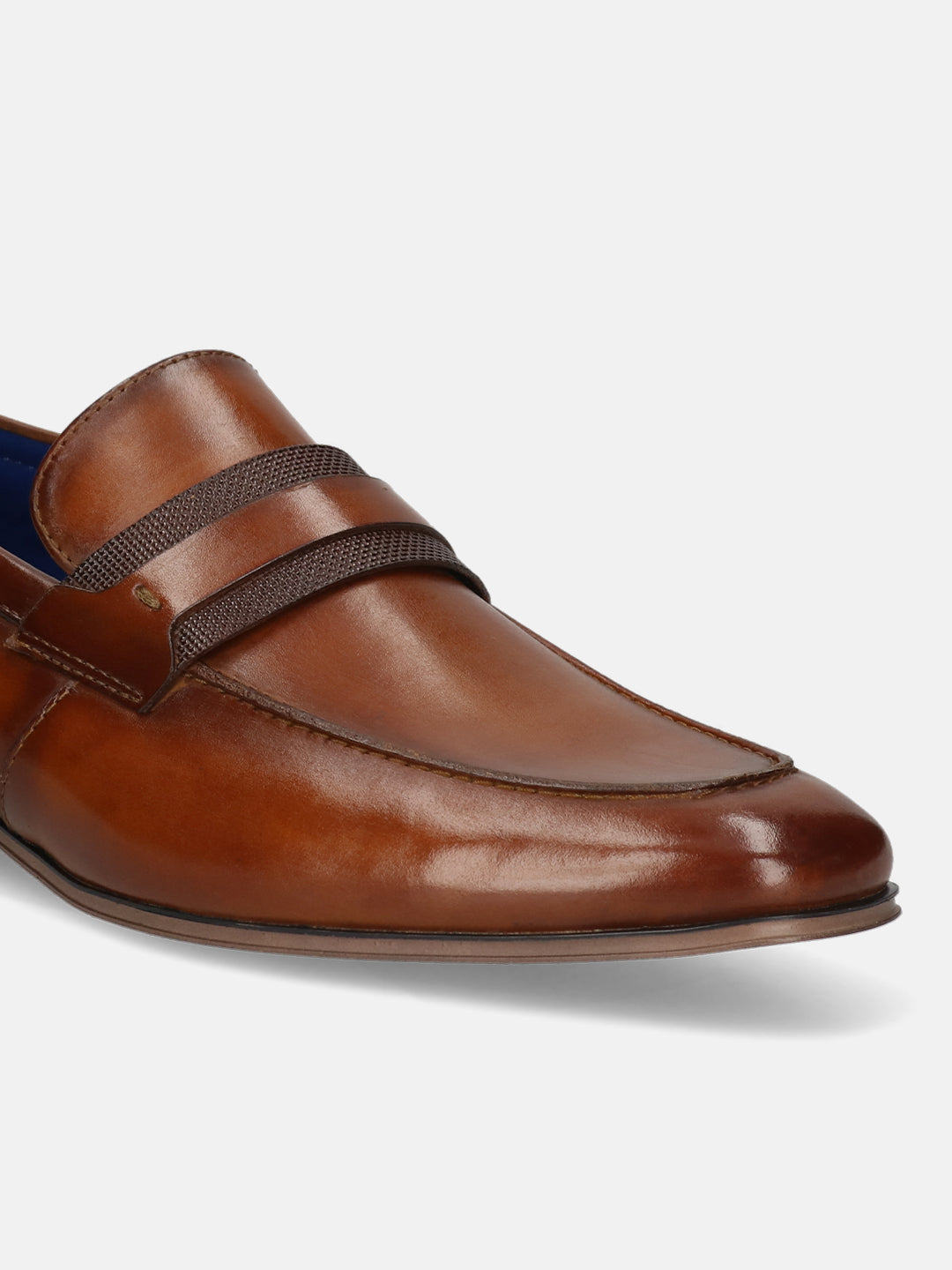 Men's Bugatti penny loafer cognac leather shoes with a round toe and apron toe featuring a moulded heel , a pvc outsole.