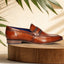 Men's Bugatti penny loafer cognac leather shoes with a round toe and apron toe featuring a moulded heel , a pvc outsole.