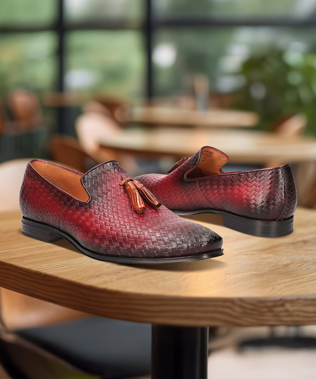 bugatti Margo red leather slip-on dress shoes with a woven texture and tassel detail.