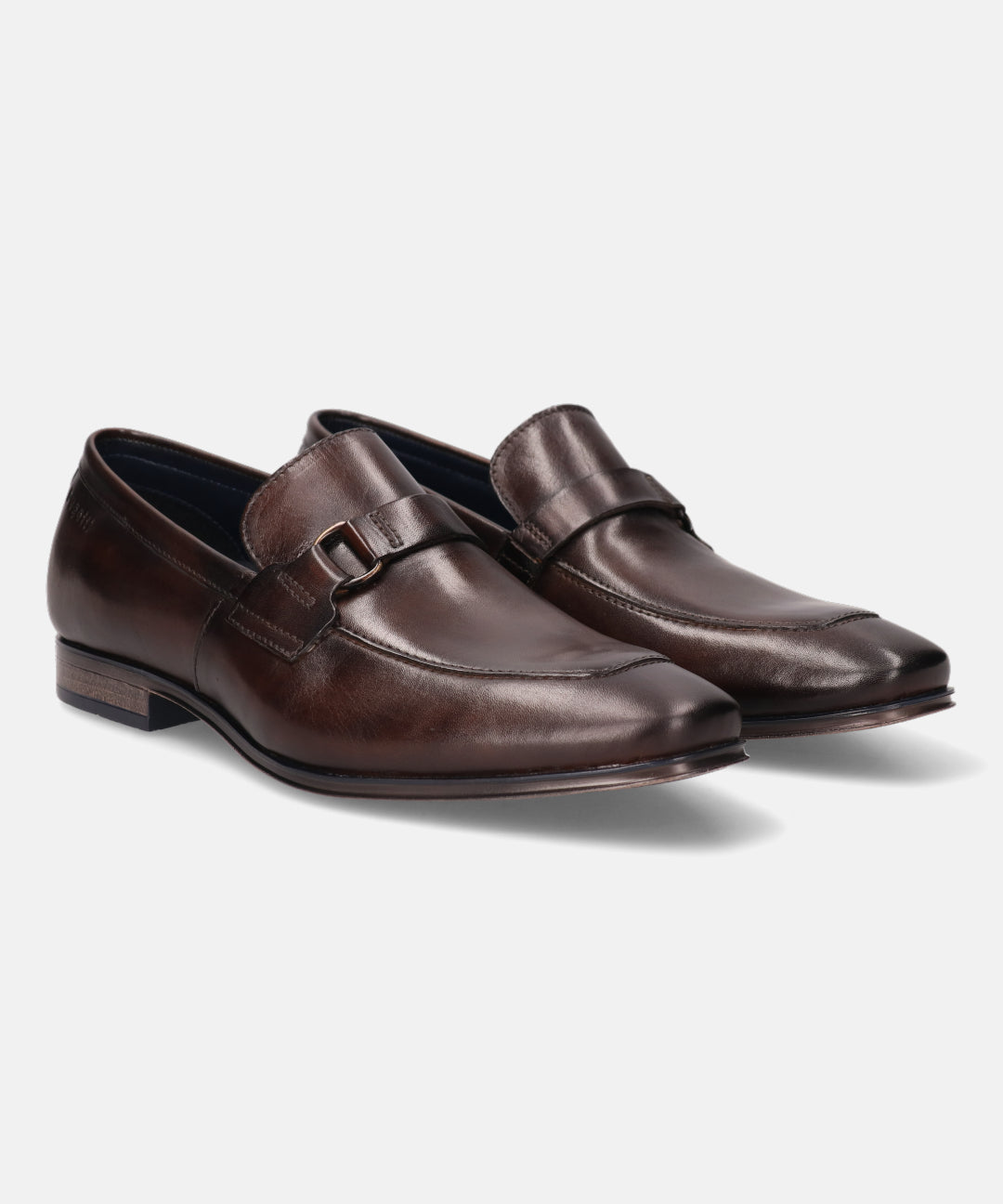 A brown Men's bugatti Bit Loafer featuring a round toe apron toe, stacked heel. Made from premium genuine leather with a durable high quality synthetic outsole, this slip-on design offers both style and comfort.