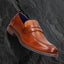A cognac Men's bugatti Penny Loafer featuring a round apron toe, moulded  heel. Made from premium genuine leather with a durable tr outsole, this slip-on design offers both style and comfort.