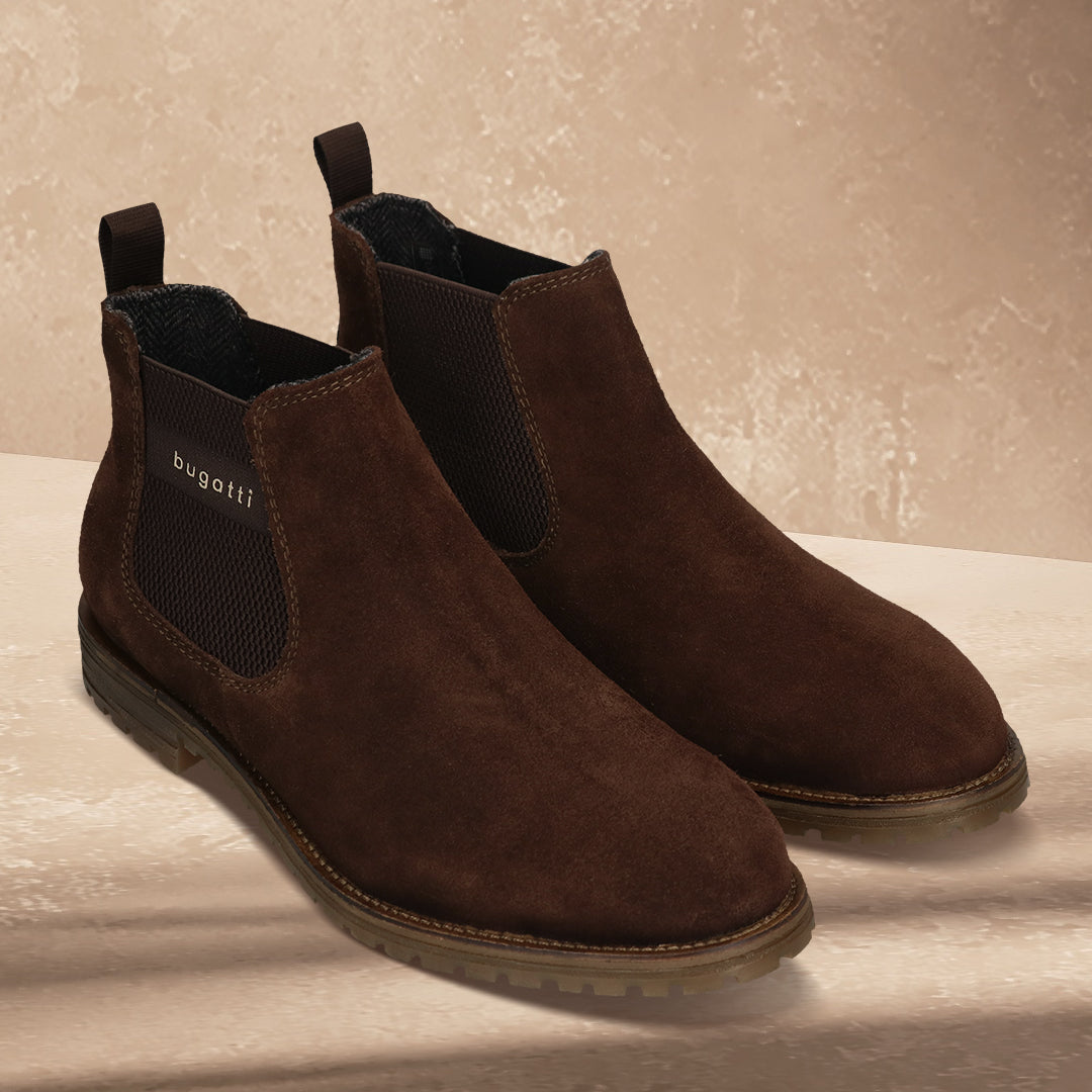 A brown Men's bugatti Chelsea Boots featuring a round toe plain toe, moulded  heel, and a wide fit. Made from premium genuine leather with a durable tr outsole, this elastic design offers both style and comfort.