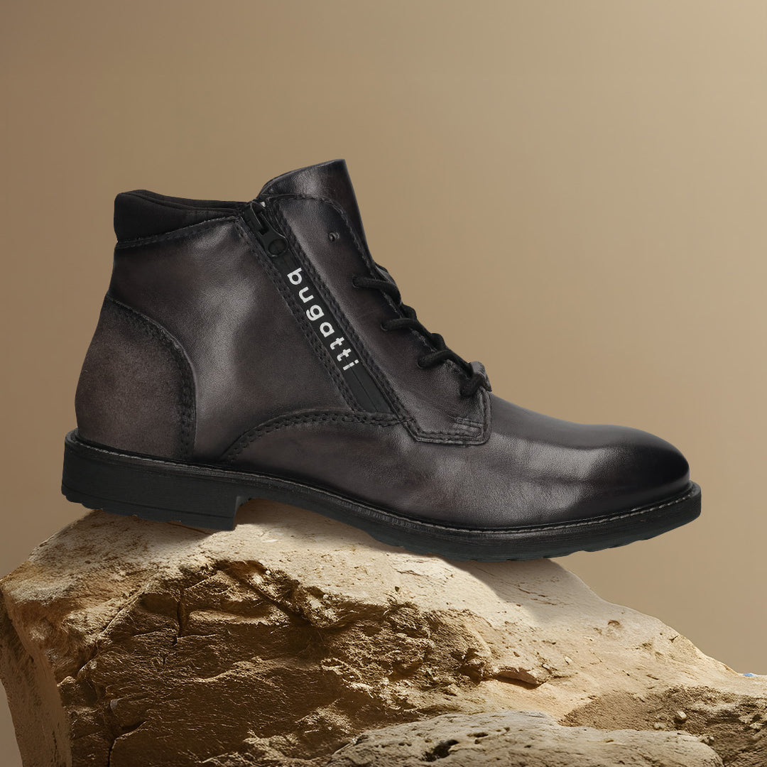 A grey Men's bugatti Ankle Boots featuring a round toe plain toe, moulded  heel, and a wide fit. Made from premium genuine leather with a durable tr outsole, this zipper design offers both style and comfort.