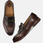 Men's Bugatti kiltie loafer brown leather shoes with a round toe and apron toe featuring a stacked heel , a leather outsole.