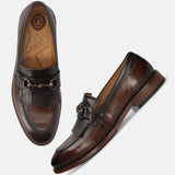 Men's Bugatti kiltie loafer brown leather shoes with a round toe and apron toe featuring a stacked heel , a leather outsole.