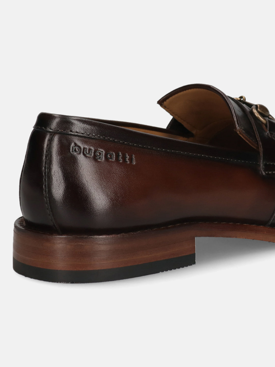 Men's Bugatti kiltie loafer brown leather shoes with a round toe and apron toe featuring a stacked heel , a leather outsole.