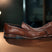 A cognac Men's bugatti Penny Loafer featuring a round toe apron toe, stacked heel. Made from premium genuine leather with a durable leather outsole, this slip-on design offers both style and comfort.