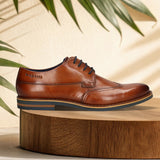 Men's Bugatti derby cognac leather shoes with a round toe and wing tip featuring a stacked heel , a eva outsole , and laces fastening.