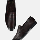 Men's Bugatti penny loafer red leather shoes with a round toe and apron toe featuring a stacked heel , a tpr outsole.