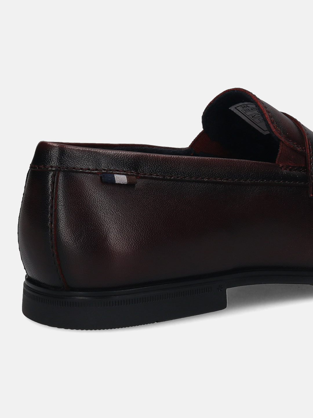 Men's Bugatti penny loafer red leather shoes with a round toe and apron toe featuring a stacked heel , a tpr outsole.