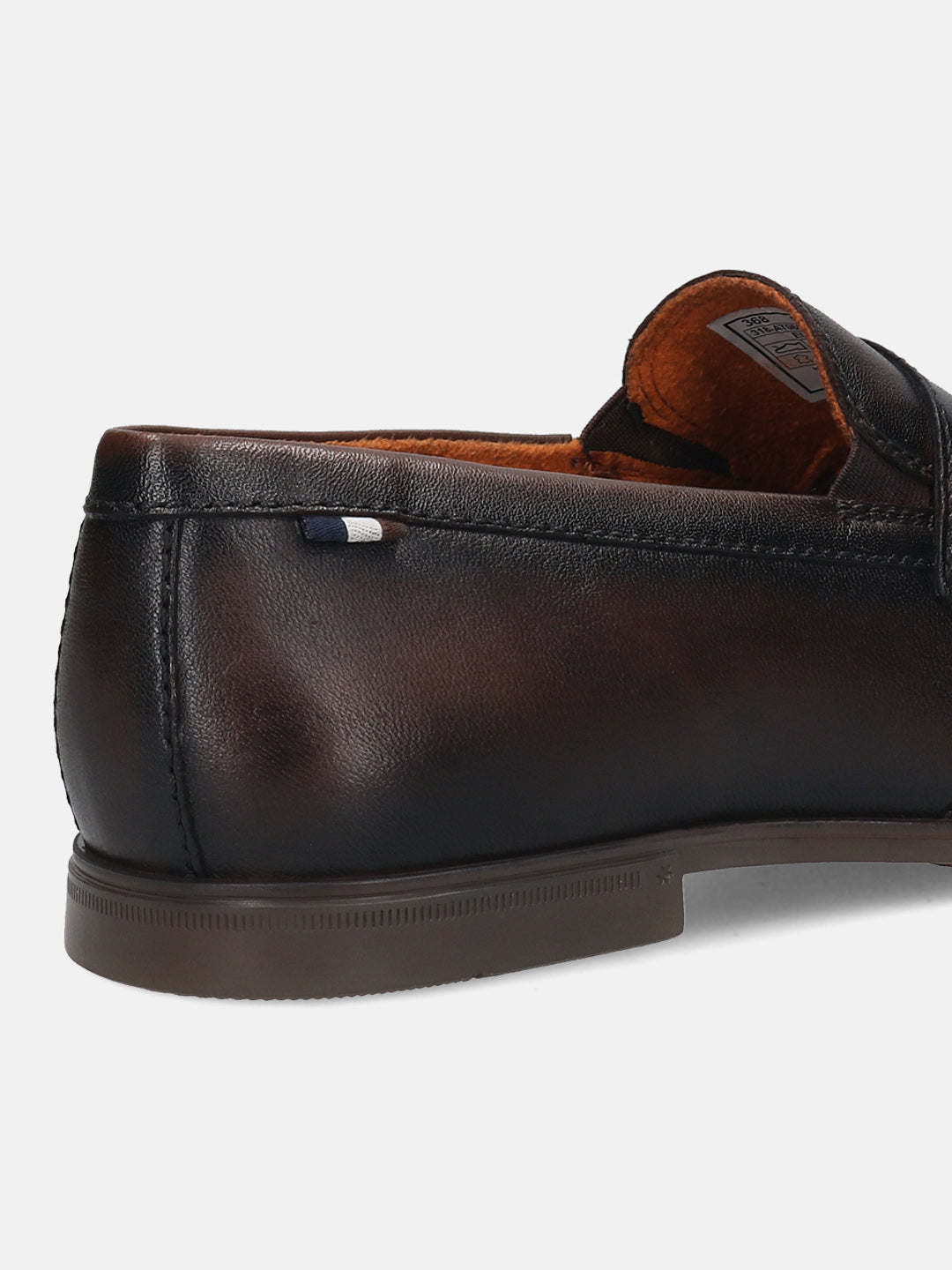 Men's Bugatti penny loafer brown leather shoes with a round toe and apron toe featuring a stacked heel , a tpr outsole.