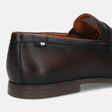 Men's Bugatti penny loafer brown leather shoes with a round toe and apron toe featuring a stacked heel , a tpr outsole.