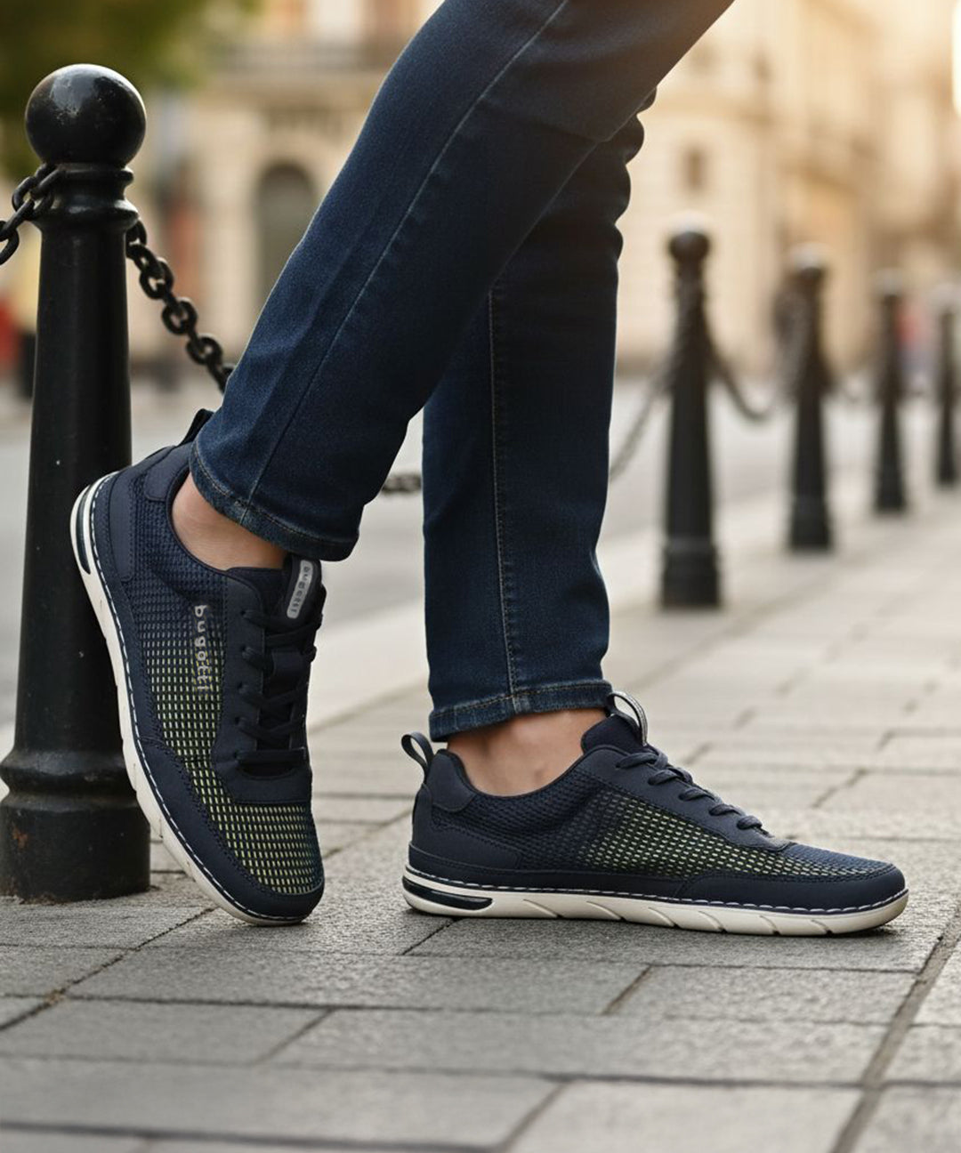 Lifestyle close-up of the bugatti Glenans dark blue comfort sneakers, featuring a sporty style and mesh texture.