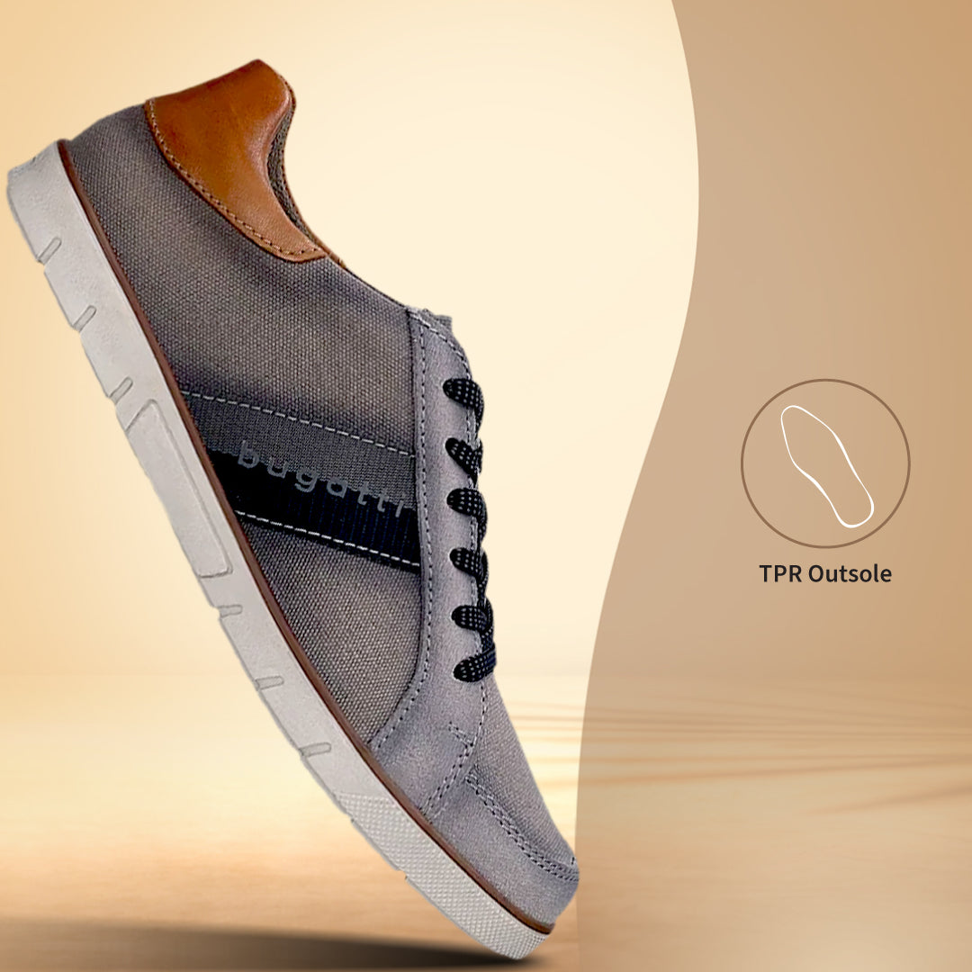 Side view of a bugatti PACIFIC grey sneaker, featuring canvas material, black laces, and a brown heel accent.