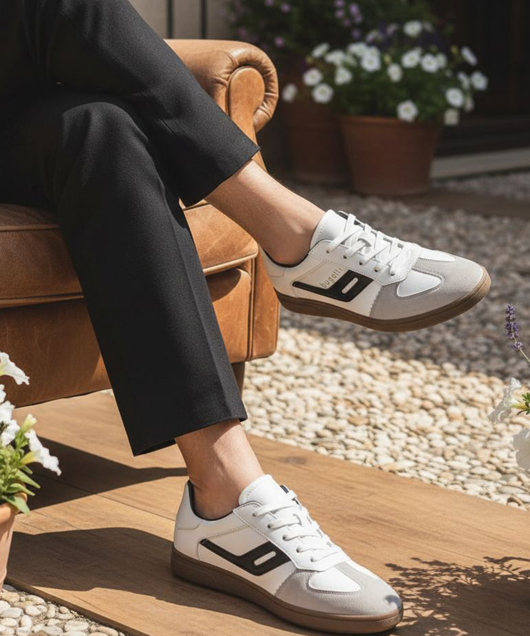 Lifestyle shot of bugatti Carmelo white sneakers, a modern, low-profile style with suede and white leather accents.
