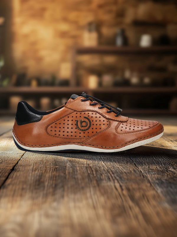 A cognac Men's bugatti Sneakers featuring a round toe plain toe, zero heels heel. Made from premium genuine leather with a durable sebs (block copolymer) outsole, this elastic design offers both style and comfort.