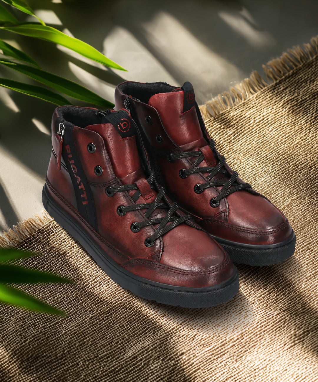 A grey Men's bugatti Casual Boots featuring a round toe plain toe, zero heels heel, and a wide fit. Made from premium genuine leather with a durable tr outsole, this zipper design offers both style and comfort.