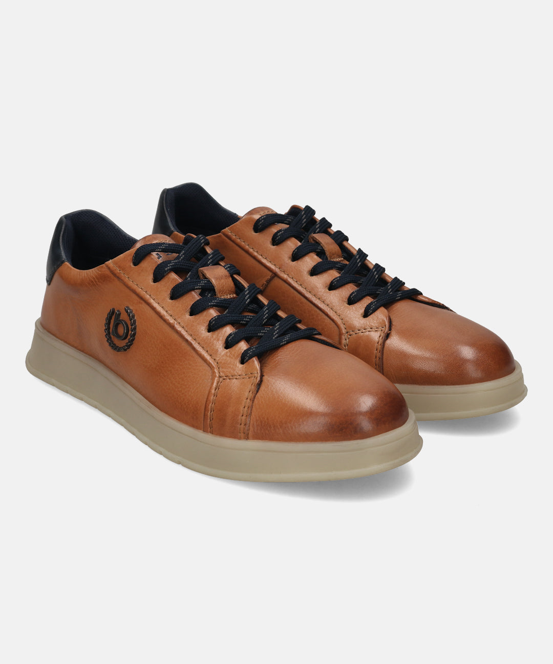 Cognac leather sneakers by bugatti with dark blue laces and collar detail, on a light beige sole.
