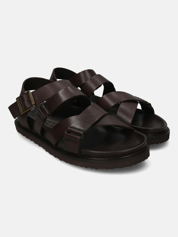 A brown Men's bugatti Back Strap Sandals featuring a open toe plain toe, zero heels heel, and a wide fit. Made from premium genuine leather with a durable eva outsole, this buckle design offers both style and comfort.