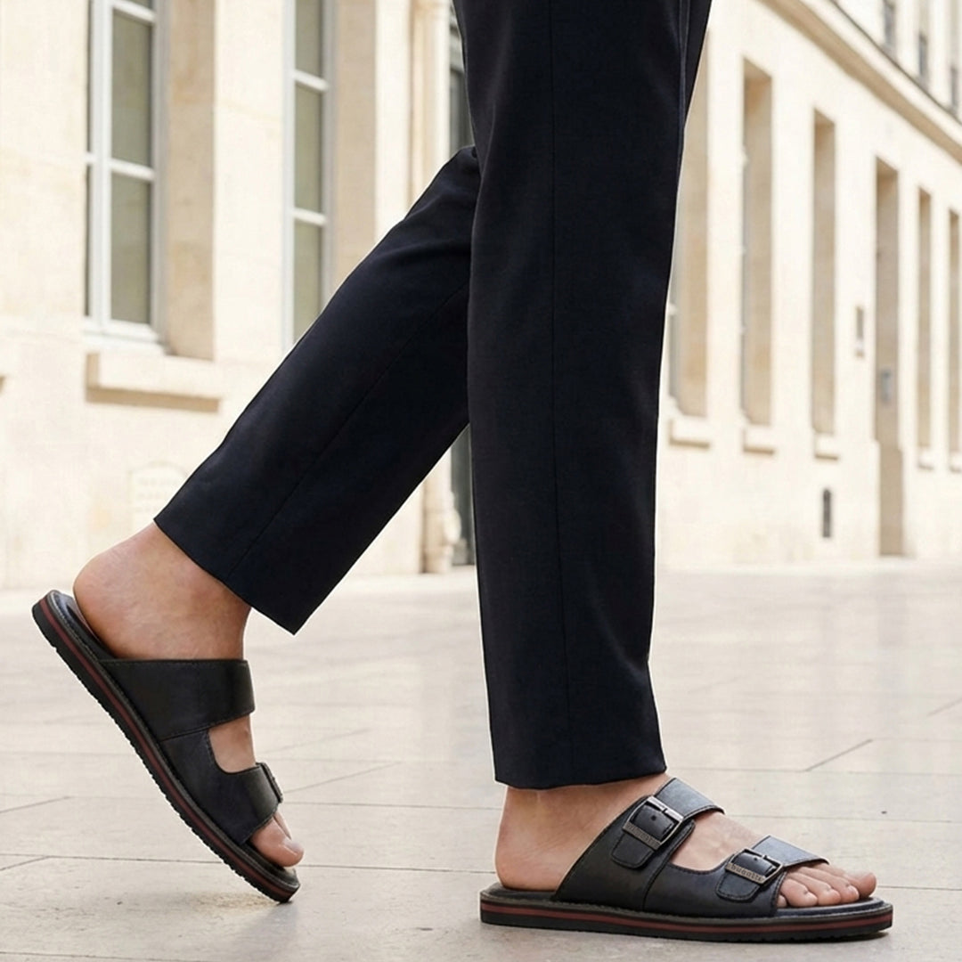 bugatti Cobie black leather sandals with adjustable buckle straps and red stripe on the sole.
