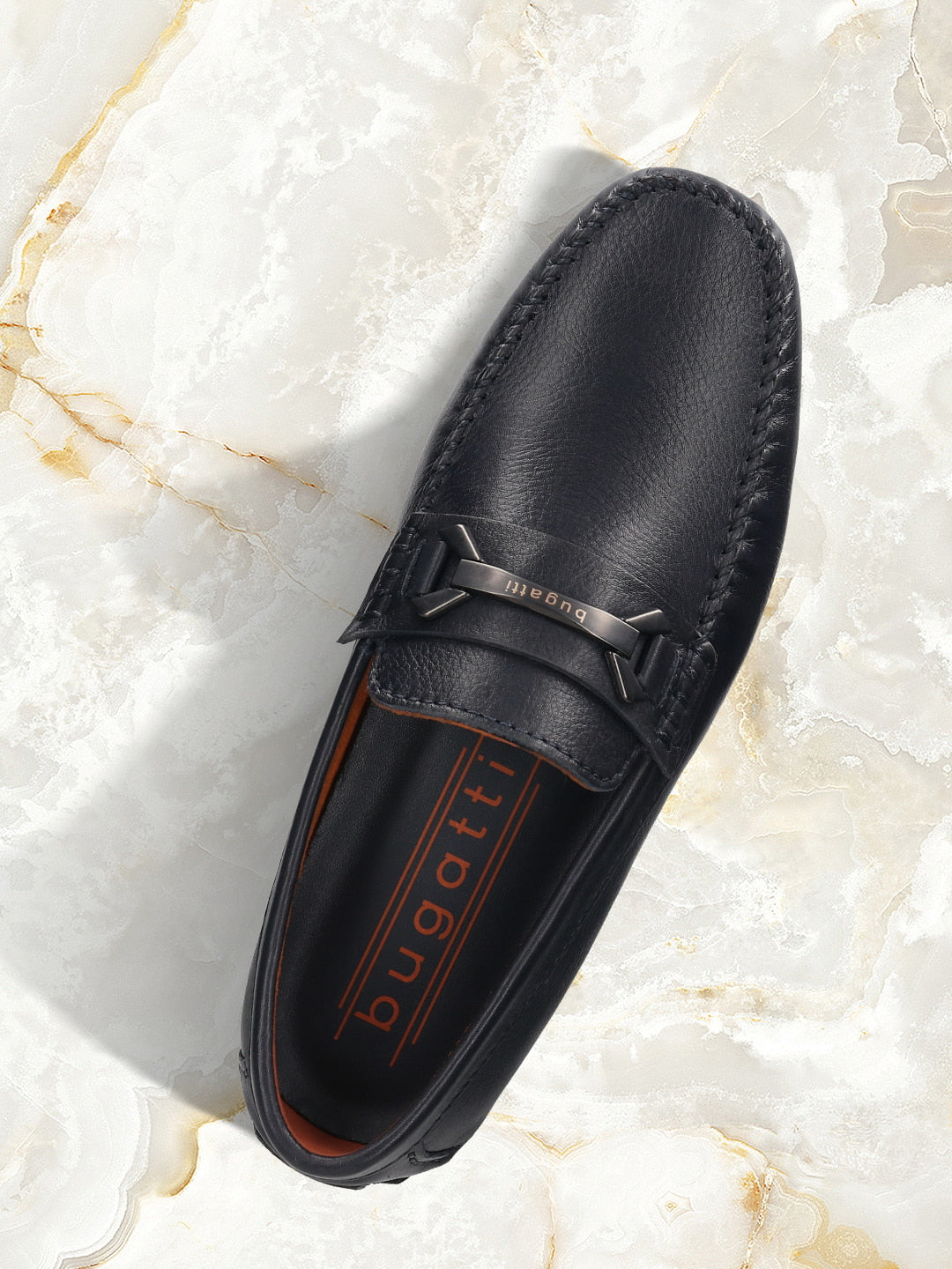 Men's Bugatti drivers blue leather shoes with a round toe and apron toe , a rubber outsole.