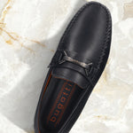 Men's Bugatti drivers blue leather shoes with a round toe and apron toe , a rubber outsole.