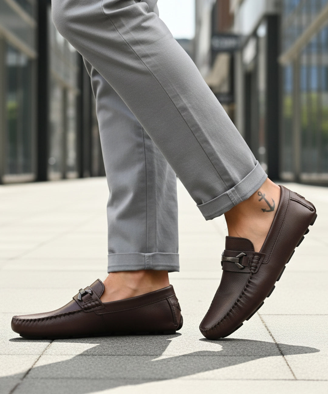 Bugatti Olexa bordo slip-on shoes in brown premium leather, featuring a decorative metal accent and rubber soles.
