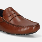 Men's Bugatti drivers cognac leather shoes with a round toe and apron toe , a tpr outsole.