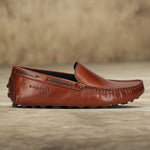 Men's Bugatti drivers cognac leather shoes with a round toe and apron toe , a tpr outsole.