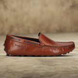 Men's Bugatti drivers cognac leather shoes with a round toe and apron toe , a tpr outsole.