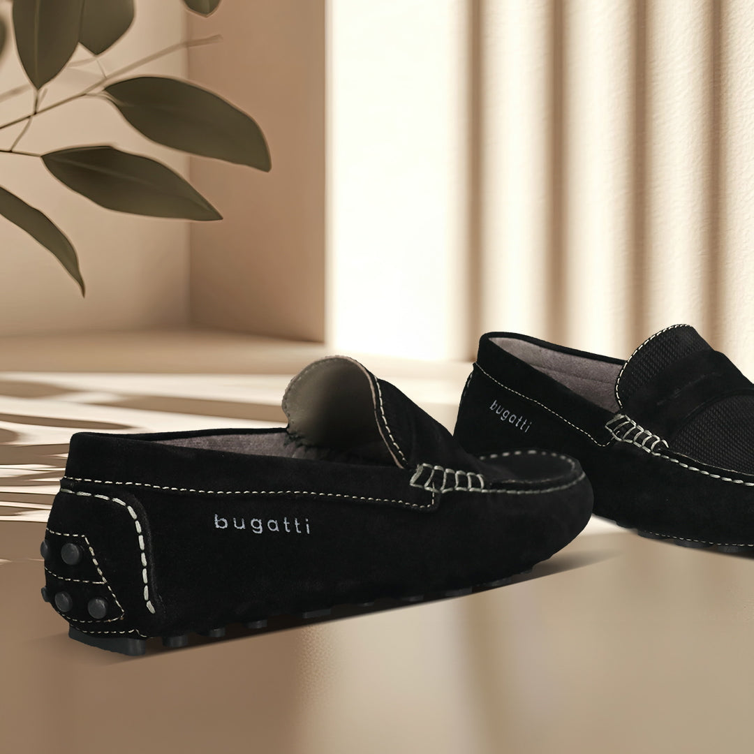 Men's Bugatti drivers black leather shoes with a round toe and apron toe , a tpr outsole.