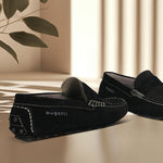 Men's Bugatti drivers black leather shoes with a round toe and apron toe , a tpr outsole.