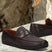 A brown Men's bugatti Drivers featuring a round toe apron toe, zero heels heel. Made from premium genuine leather with a durable rubber outsole, this slip-on design offers both style and comfort.