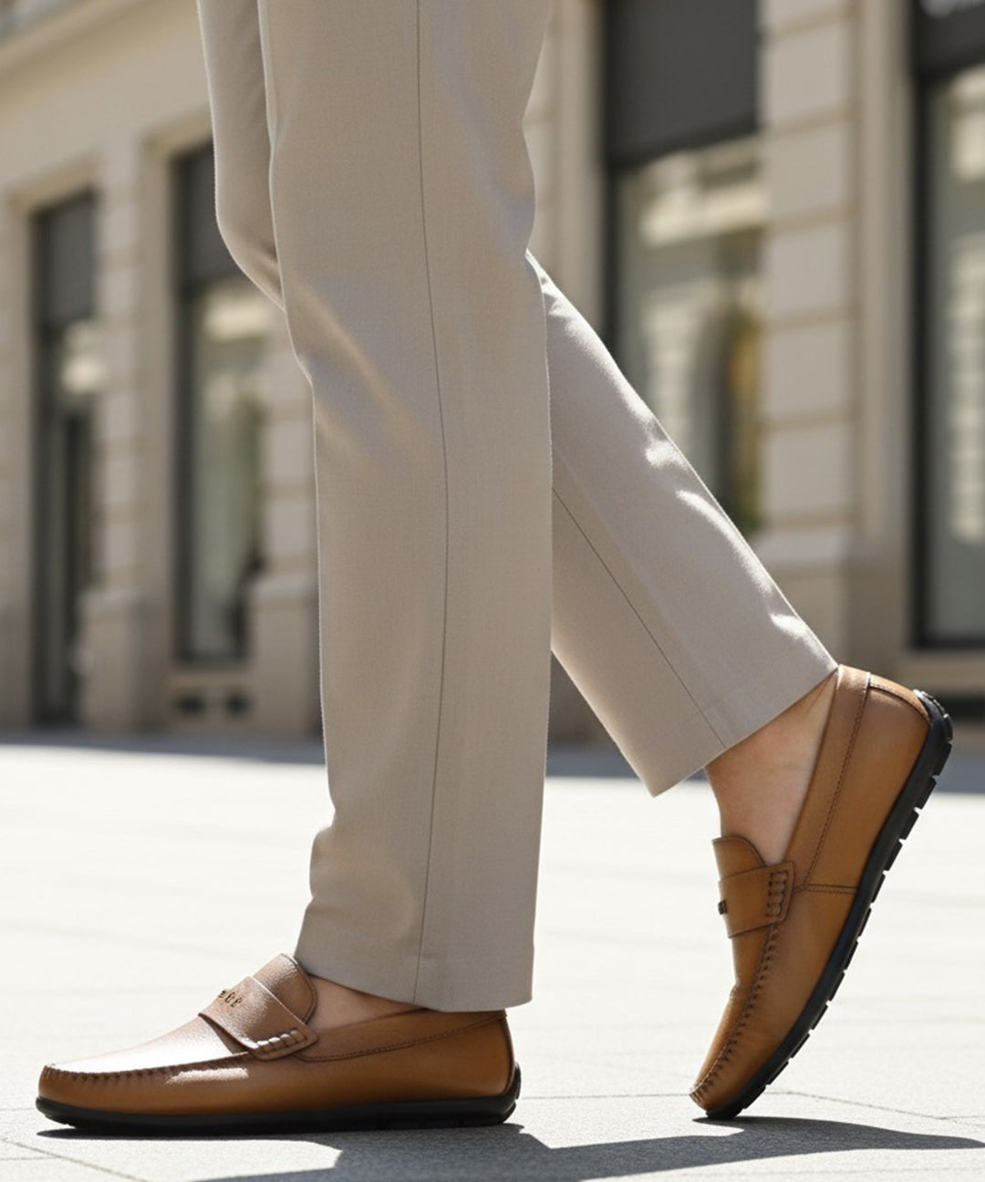 bugatti Linex yellow leather slip-on shoes with moccasin style, worn with light neutral dress pants.
