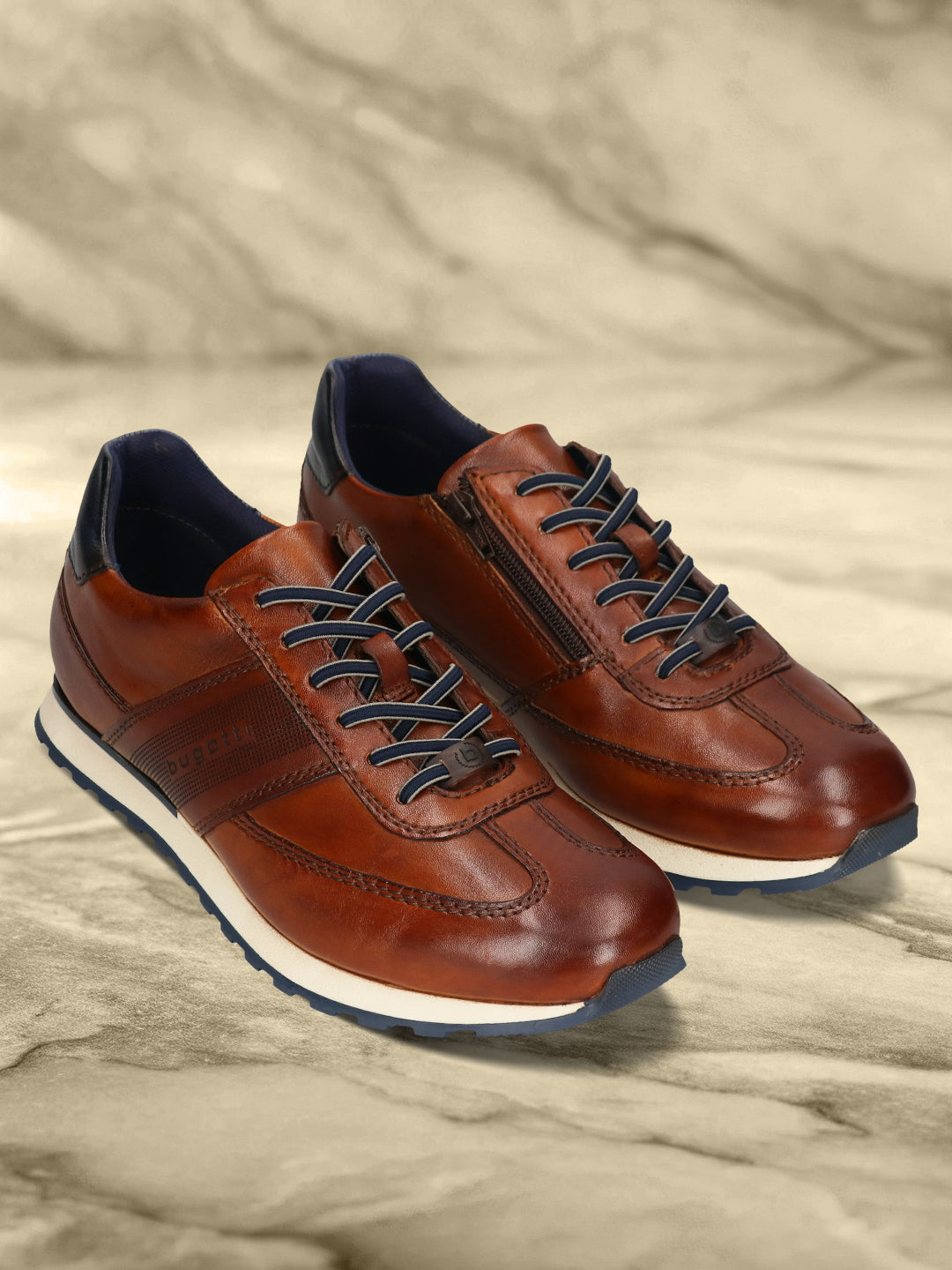 Men's Bugatti leather cognac leather shoes with a round toe , a tpr outsole , and laces fastening.