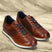 Men's Bugatti leather cognac leather shoes with a round toe , a tpr outsole , and laces fastening.