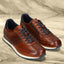 Men's Bugatti leather cognac leather shoes with a round toe , a tpr outsole , and laces fastening.