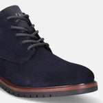 A blue Men's bugatti Chukka Boots featuring a round toe plain toe, stacked heel. Made from suede leather with a durable tpr outsole, this laces design offers both style and comfort.
