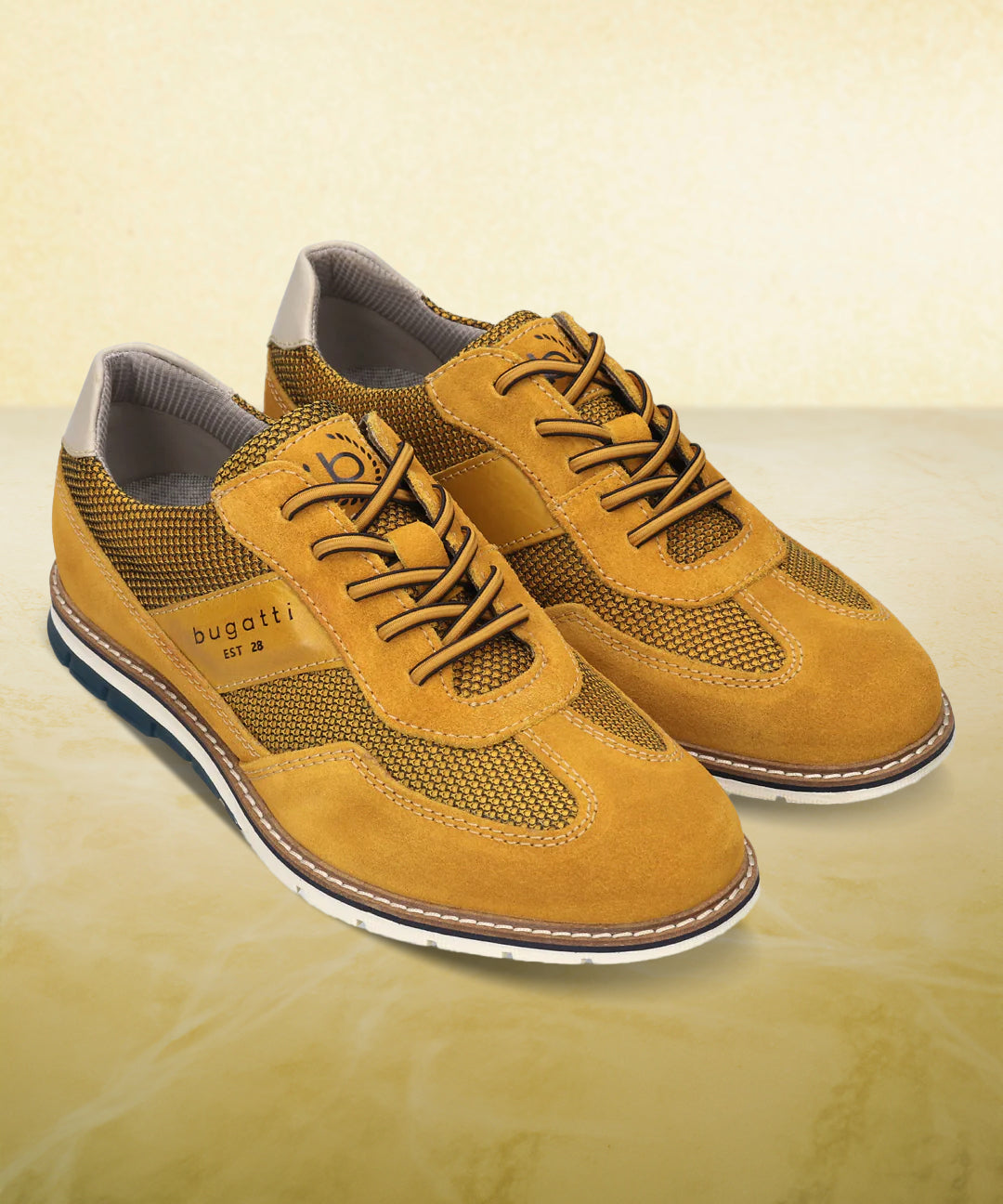 A yellow Men's bugatti Casuals Shoes featuring a round toe wing tip, zero heels heel, and a wide fit. Made from premium genuine leather with a durable tr outsole, this laces design offers both style and comfort.