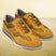 A yellow Men's bugatti Casuals Shoes featuring a round toe wing tip, zero heels heel, and a wide fit. Made from premium genuine leather with a durable tr outsole, this laces design offers both style and comfort.