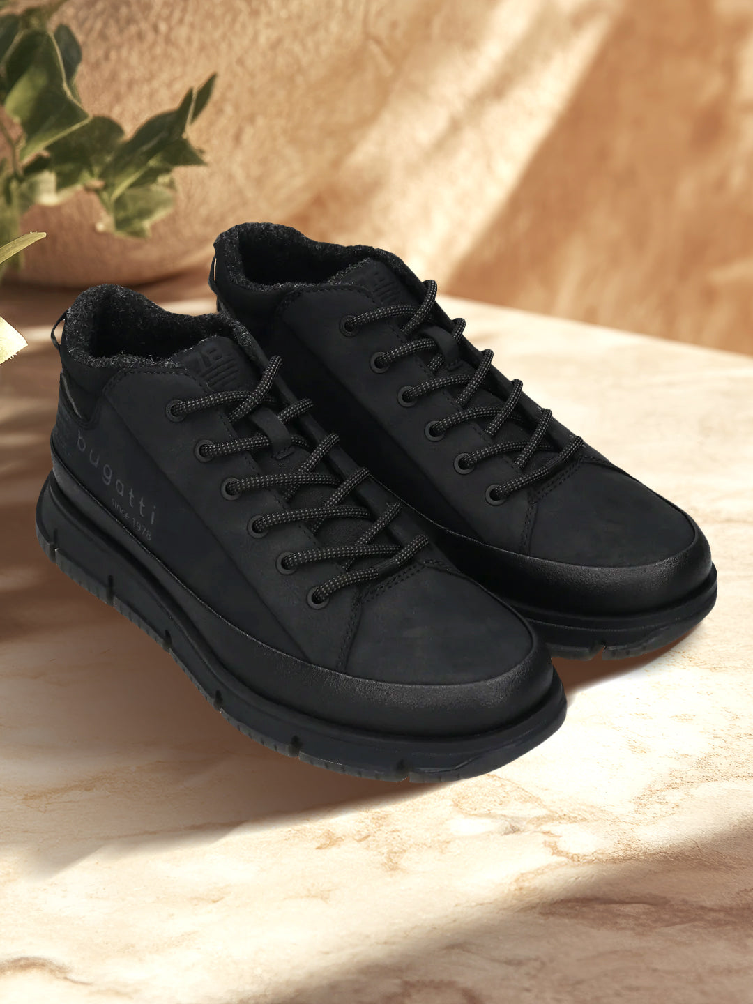 A black Men's bugatti Outdoor Sneakers featuring a round toe plain toe, zero heels heel. Made from synthetic with a durable eva outsole, this laces design offers both style and comfort.