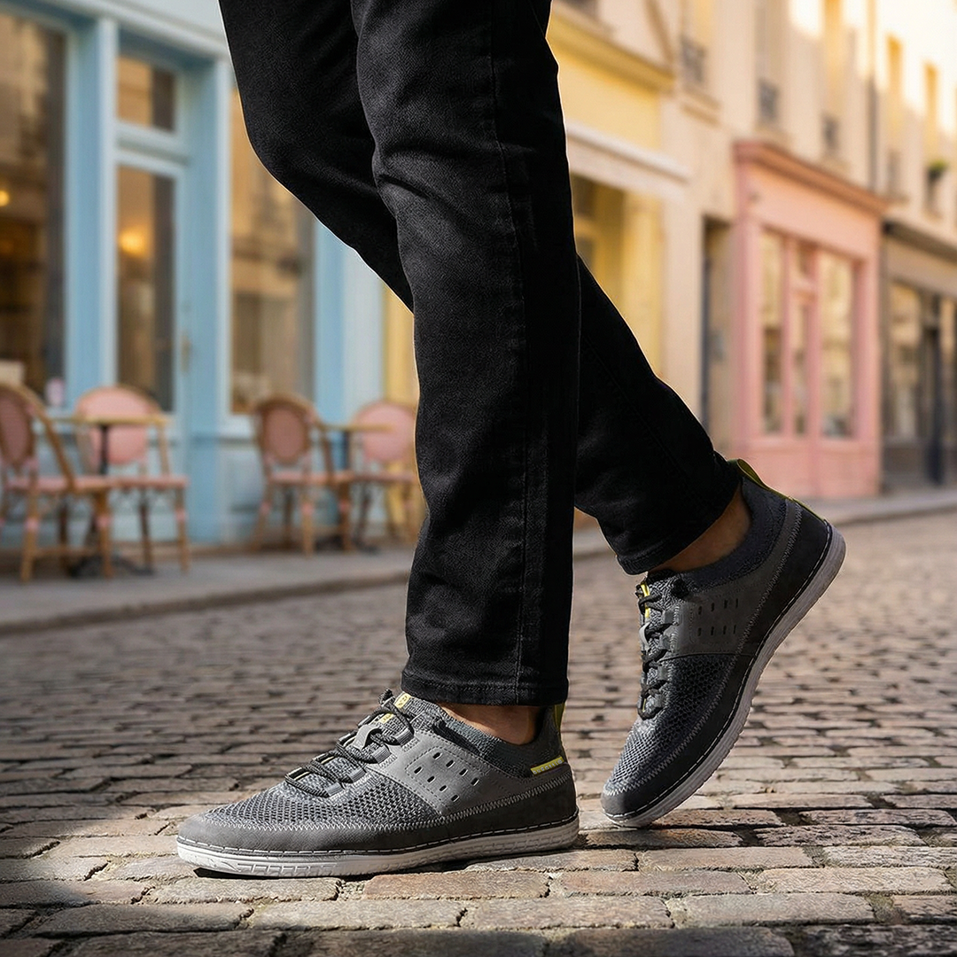 Lifestyle shot of bugatti Bimini grey low top sneakers with a knit texture and black laces.
