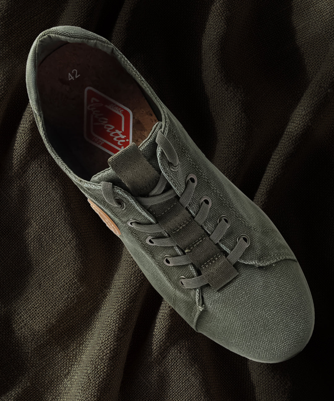 A green Men's bugatti Sneakers featuring a round plain toe, zero heels heel. Made from textile with a durable eva outsole, this laces design offers both style and comfort.